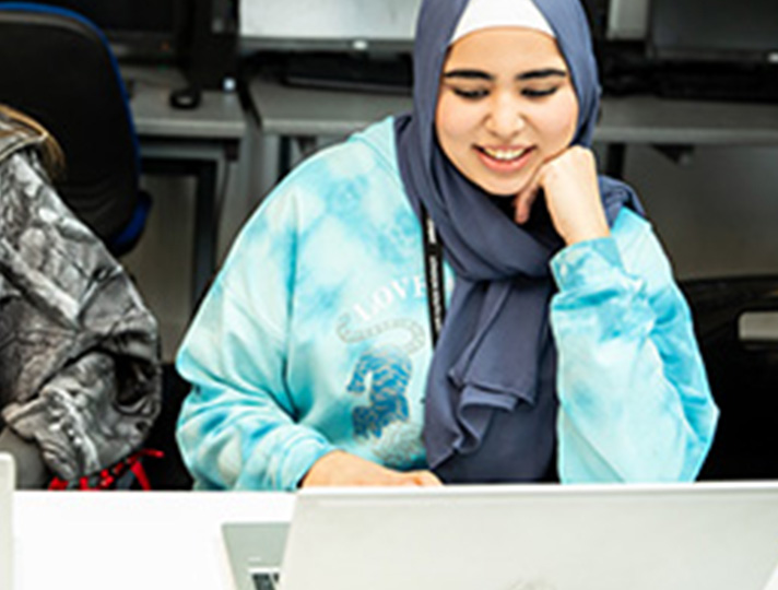 Female student working at a desk